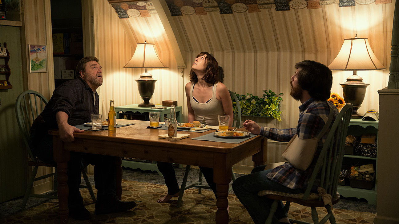 John Goodman as Henry; Mary Elizabeth Winstead as Michelle; and John Gallagher Jr. in 10 CLOVERFIELD LANE; by Paramount 